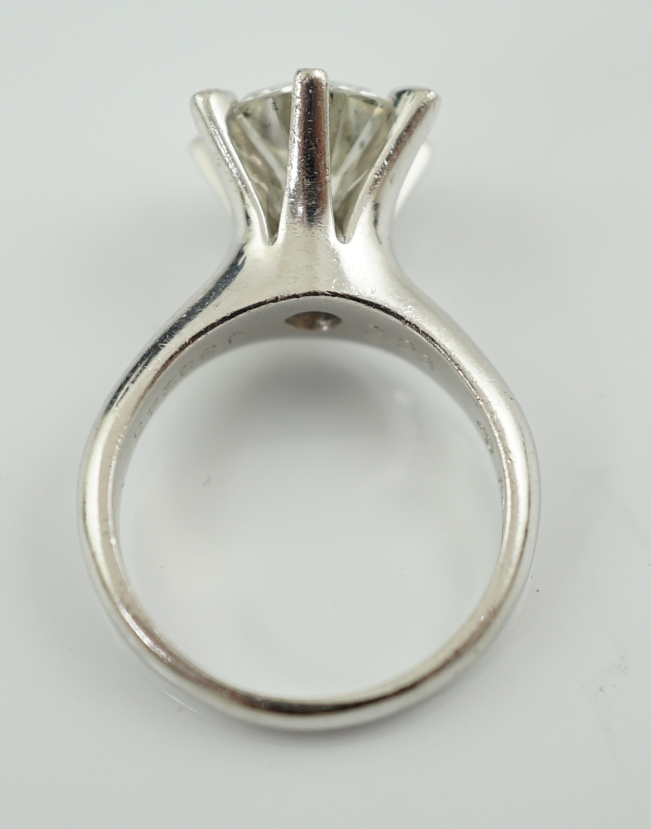 A modern platinum and solitaire diamond set ring